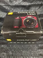 Closed retail box showing model and camera image