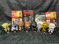 Group shot of 8 loose Star Wars Funko Pop! figures and 4 sealed ReAction carded figures