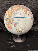 Full view of globe front showing Africa, Atlantic, base and meridian