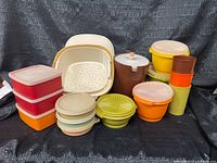 Group shot of all 16 Tupperware pieces showing colours and variety
