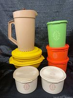 Group shot showing all seven containers with lids stacked and arranged