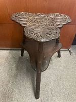 Full view of carved wood plant stand
