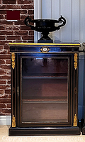 Frontal view showing pair of ebonized pier cabinets side by side