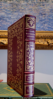 Front and spine view of the burgundy leather bound Wuthering Heights book with gold decoration.