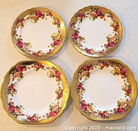 Four Royal Chelsea porcelain plates arranged in a grid showing floral patterns and gold trimmed edges