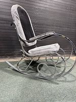 Side view showing chrome flatbar frame and vinyl upholstery