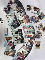 Overview of assorted hockey cards arranged on a surface, showing action images and facsimile signatures.