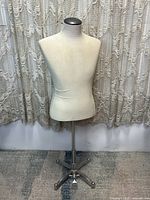 Full view of the vintage male chest mannequin on a metal stand with five-legged base and foot pedal, showing overall shape and height.