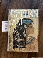 Front cover of the book showing Egyptian artwork with title 'Egyptian Art'.