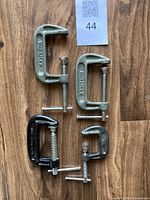 Top-down view of all four clamps showing sizes and brands