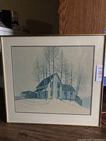 Full view of framed art print showing the farmhouse winter scene and frame.