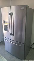 Front view of closed stainless steel French door refrigerator