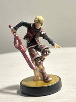 Front angle of Shulk Amiibo figure showing pose and sword detail.