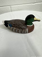 Front view of the hand painted wood duck decoy showing detailed carving and multicolor paint.