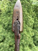 Close-up of copper spade tip and iron shaft
