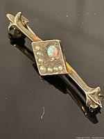 Front view showing opal and seed pearls on bar pin
