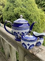 Teapot, sugar bowl with lid, creamer displayed together