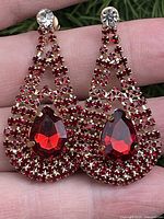 Front view of both red rhinestone drop earrings