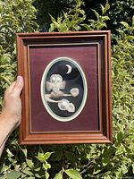 Front view of framed caribou hair tufting artwork