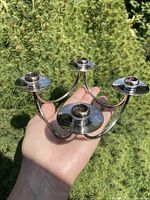 Angled view showing four bobeches and curved arms