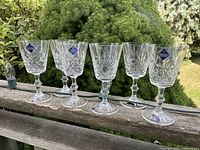 Six Edinburgh Crystal wine glasses lined up showing overall condition and labels