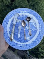 Group shot of plate with four utensils displayed