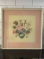 Framed handpainted floral artwork on glass