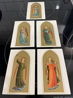 Group shot of all five gilt angel postcards