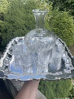 Top view of tray holding decanter and four glasses