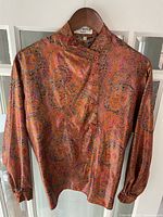 Front view of Torrente paisley blouse on hanger