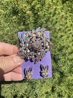 Front view of brooch and earrings showing aurora borealis rhinestones