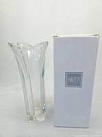 Front and side view of the clear glass Mikasa Blossom vase standing 11.75 inches tall with the original white box next to it.