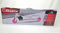 Retail packaging box of Razor Aluminum Kick Scooter with pink wheels showing product photo and features on front side.