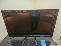 Front view of the Toshiba 40-inch flat screen TV showing the full screen and stand.