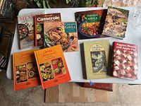 Cookbooks spread on table showing covers and titles