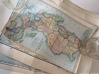 Antique map of Luzon island, Philippines with regions outlined in various colors.
