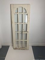 Full view of antique white painted window or cabinet door with 15 panes, showing size and overall condition