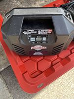 Front view of the MotoMaster compressor showing digital control panel and brand label