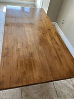 Full tabletop view showing natural pine wood grain and cracks.