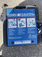 Alternate photo of sandblaster tank top label with product details and user instructions.