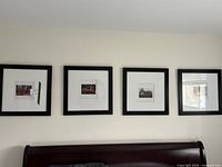 Four square framed photographic art prints arranged horizontally on wall above furniture, showing diversity in Thai cultural scenes, some with artist signatures.
