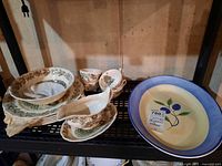 Overview of Johnson Brothers dishes and Bella platter on shelf