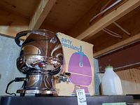 Chrome-plated party percolator and its original box.