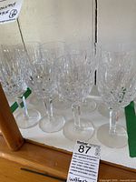 Eight wine glasses arranged on tray showing pattern and count
