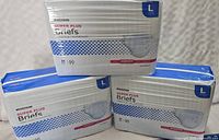 3 packs of McKesson Super Plus adult briefs, size large, with packaging showing count and capacity.