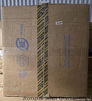 Cardboard box packaging for Midwest 24 inch iCrate dog crate showing shipping and recycling icons with some distressed areas and taped seam.