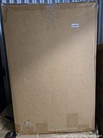 Photo of the sealed cardboard box containing the Anko Construct Table with Storage, indicating item is new and packaged for shipping or delivery.