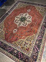 Full view of rug showing central medallion, field and border layout