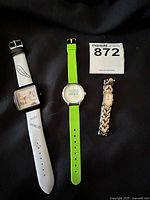 Photo showing all three ladies wrist watches together on a black background.