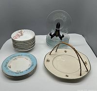 Top-down view of the assortment showing stacks of dishes and bowls with all items visible for quantity and style verification.